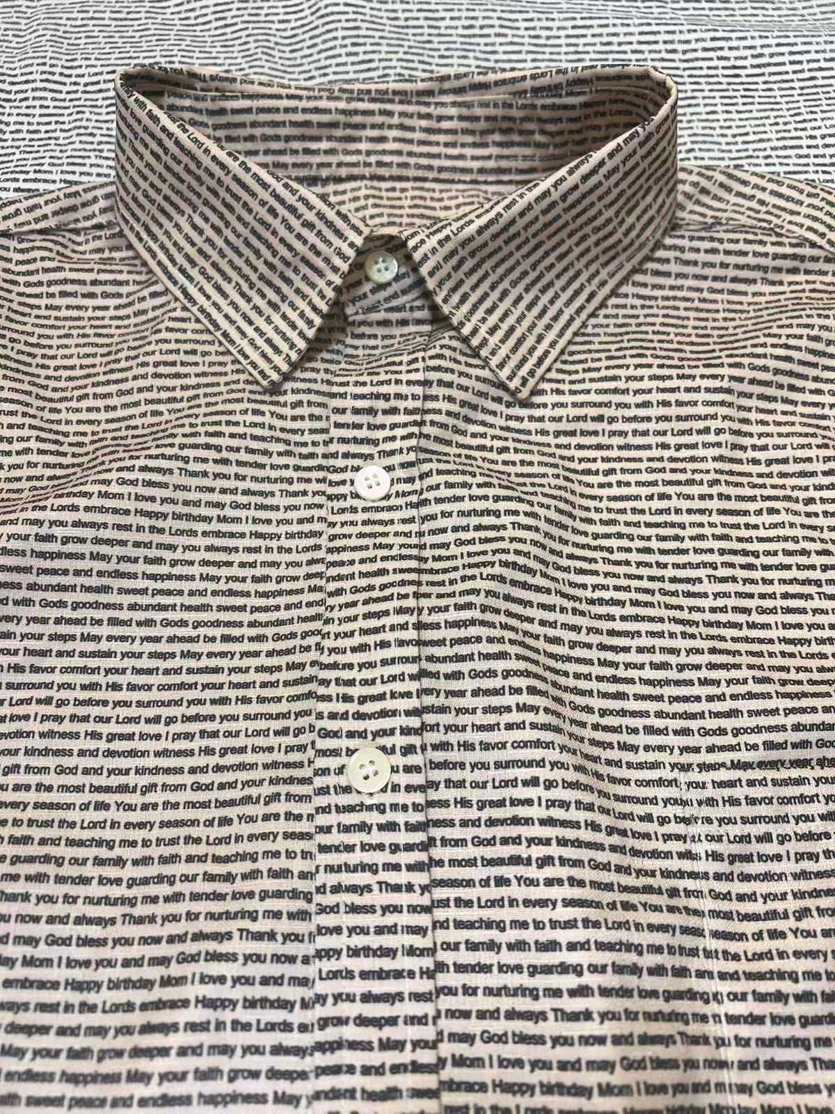 Close-up of custom text shirt collar, showcasing sharp print clarity and natural fabric drape
