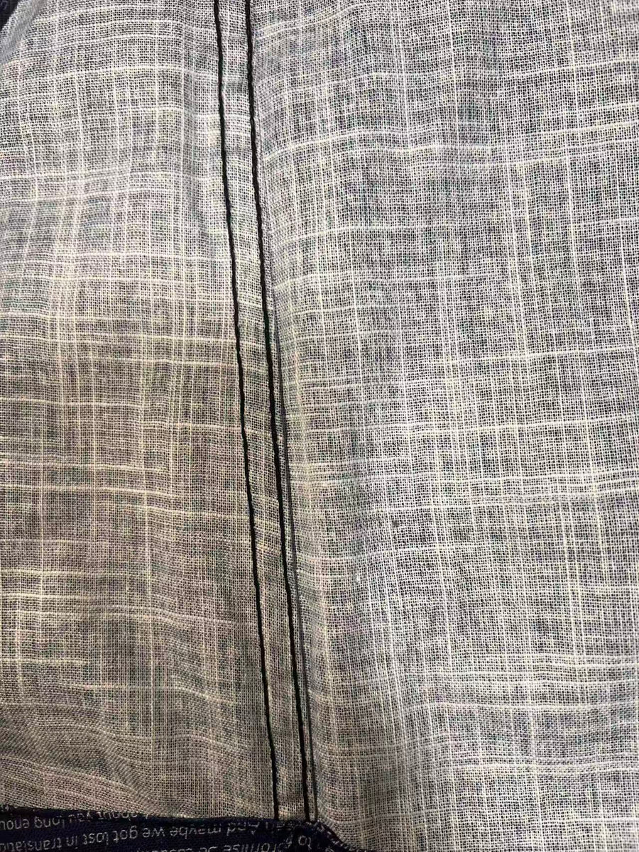 Close-up of premium slub cotton fabric with a breathable lightweight texture and neat stitching