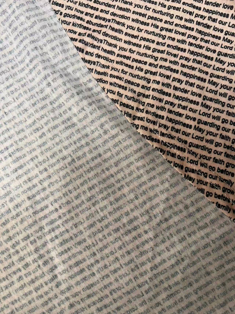 Close-up of soft cotton jersey showing gentle stretch, breathable texture, and clear custom text printing